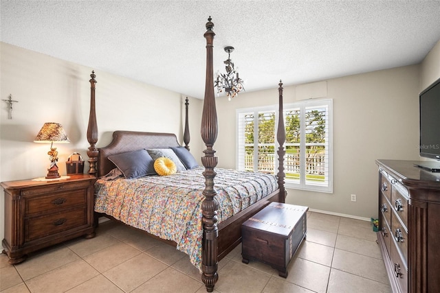 4194 Banbury Cir, Parrish, FL 34219 - bedroom with light tile patterned floors, baseboards, and a textured ceiling