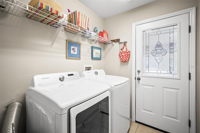 4194 Banbury Cir, Parrish, FL 34219 - laundry room featuring washing machine and clothes dryer and light tile patterned floors