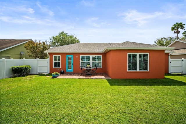 4194 Banbury Cir, Parrish, FL 34219 - back of property featuring stucco siding, a patio area, and roof with shingles