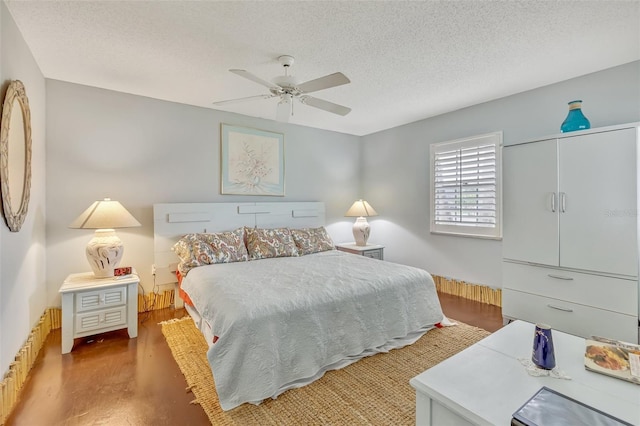 107 Van Dyck Dr, Nokomis, FL 34275 - bedroom with a textured ceiling, wood finished floors, and a ceiling fan