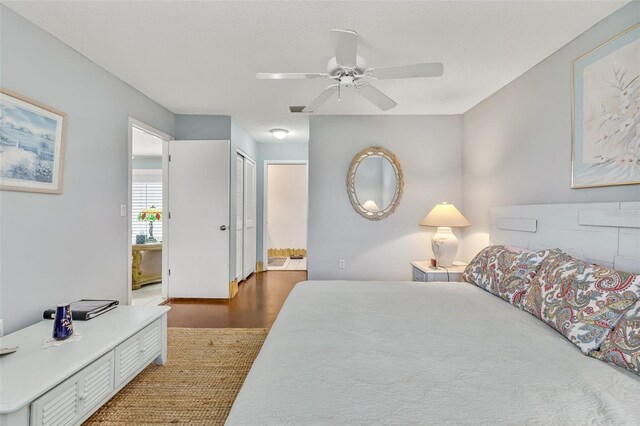 107 Van Dyck Dr, Nokomis, FL 34275 - bedroom with ensuite bathroom, wood finished floors, and a ceiling fan
