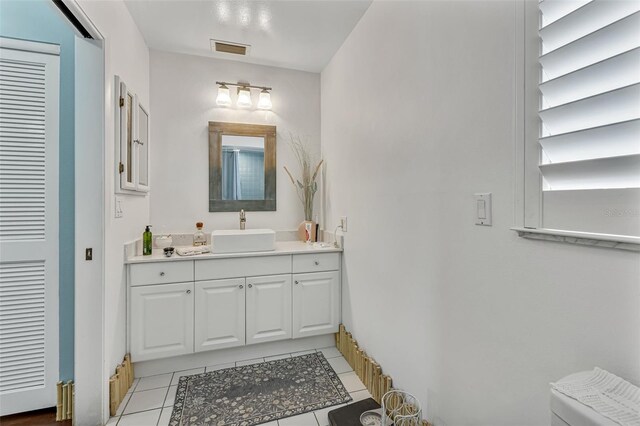 107 Van Dyck Dr, Nokomis, FL 34275 - bathroom with tile patterned flooring, vanity, and toilet