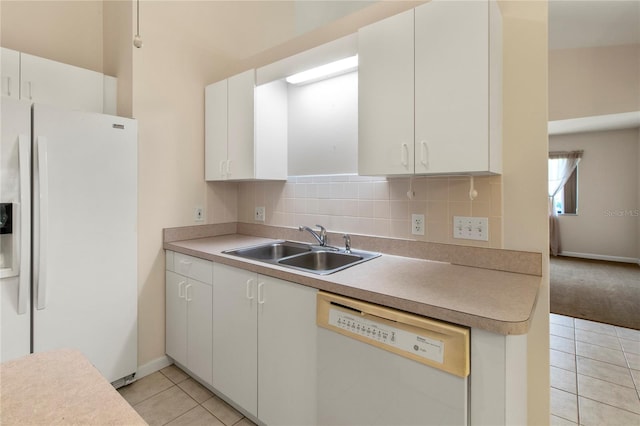 3311 39th Pl W, Bradenton, FL 34205 - kitchen with white appliances, light tile patterned flooring, a sink, light countertops, and white cabinetry