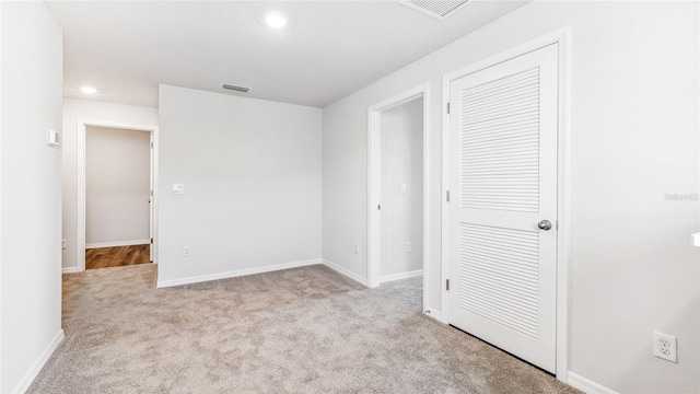 12064 Lansing Gln, Parrish, FL 34219 - unfurnished bedroom with carpet floors, recessed lighting, baseboards, and a closet