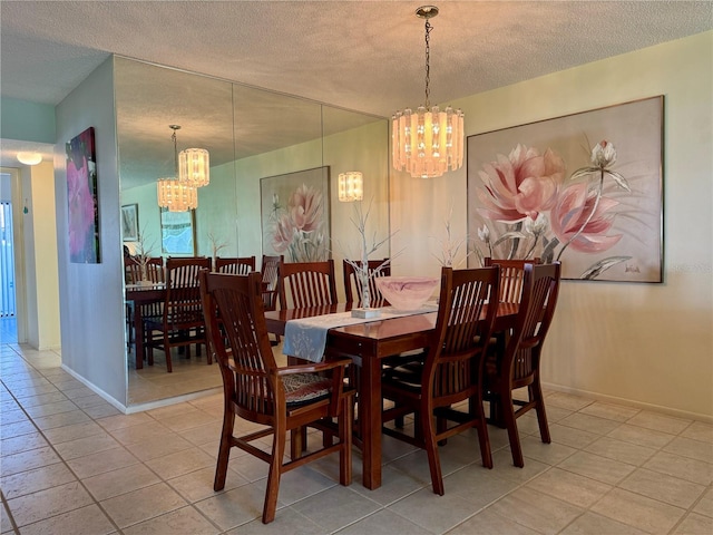 3500 El Conquistador Pkwy Unit 347, Bradenton, FL 34210 - dining space with a chandelier, a textured ceiling, and tile patterned floors