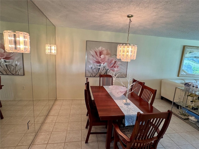 3500 El Conquistador Pkwy Unit 347, Bradenton, FL 34210 - tiled dining space featuring a chandelier and a textured ceiling