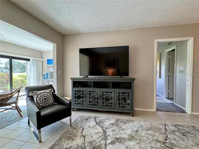 3500 El Conquistador Pkwy Unit 347, Bradenton, FL 34210 - sitting room with a textured ceiling and tile patterned flooring