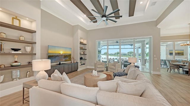 8537 Pavia Way, Bradenton, FL 34202 - living area with a ceiling fan, light wood finished floors, built in features, ornamental molding, and recessed lighting