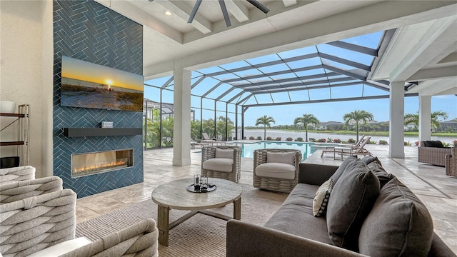 8537 Pavia Way, Bradenton, FL 34202 - view of patio featuring an outdoor living space with a fireplace, a water view, a ceiling fan, and an outdoor pool
