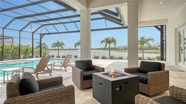 8537 Pavia Way, Bradenton, FL 34202 - view of patio / terrace with an outdoor fire pit, french doors, a water view, and an outdoor pool