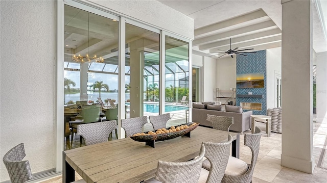 8537 Pavia Way, Bradenton, FL 34202 - dining area with a ceiling fan, healthy amount of natural light, a sunroom, a textured wall, and beamed ceiling
