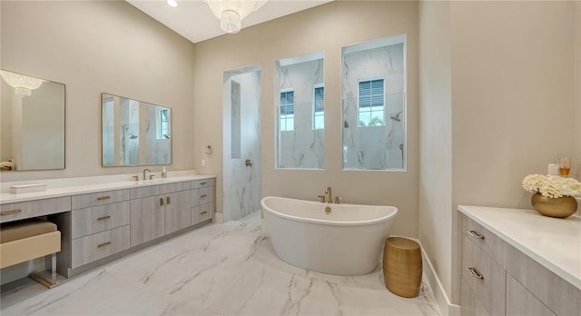 8537 Pavia Way, Bradenton, FL 34202 - full bath with vanity, a freestanding tub, a marble finish shower, and marble finish floors