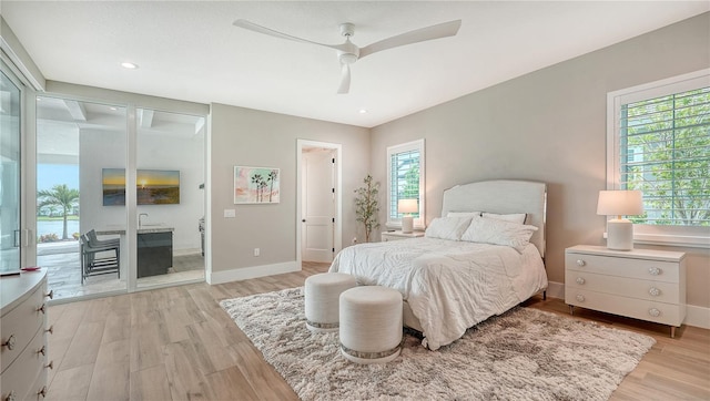 8537 Pavia Way, Bradenton, FL 34202 - bedroom featuring light wood-type flooring, access to outside, ceiling fan, and recessed lighting