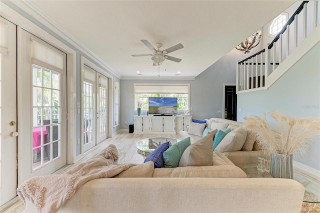 8963 Fishermens Bay Dr, Sarasota, FL 34231 - living room with ornamental molding, light wood-style floors, and ceiling fan