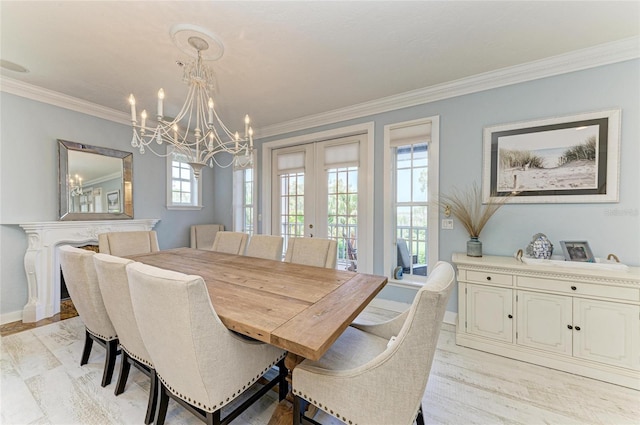 8963 Fishermens Bay Dr, Sarasota, FL 34231 - dining space featuring french doors, a chandelier, and crown molding
