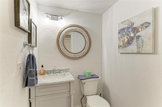 8963 Fishermens Bay Dr, Sarasota, FL 34231 - half bath with vanity and a textured wall