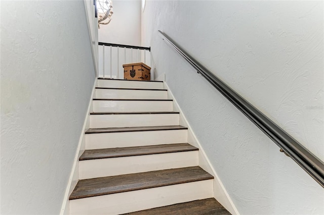 8963 Fishermens Bay Dr, Sarasota, FL 34231 - stairs featuring wood finished floors