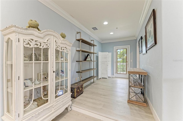 8963 Fishermens Bay Dr, Sarasota, FL 34231 - entryway featuring crown molding, wood finished floors, and recessed lighting