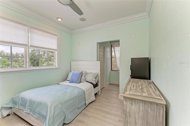 8963 Fishermens Bay Dr, Sarasota, FL 34231 - bedroom with ornamental molding, light wood-type flooring, and ceiling fan
