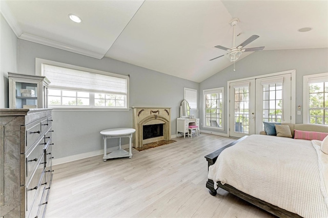 8963 Fishermens Bay Dr, Sarasota, FL 34231 - bedroom with access to outside, a premium fireplace, french doors, light wood-style floors, and vaulted ceiling