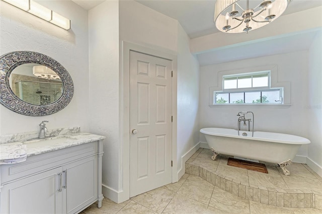 8963 Fishermens Bay Dr, Sarasota, FL 34231 - full bathroom with a chandelier, vanity, and a freestanding tub