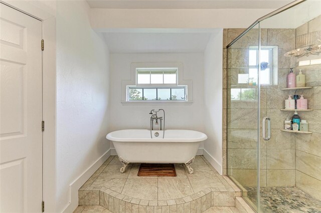8963 Fishermens Bay Dr, Sarasota, FL 34231 - bathroom featuring a freestanding bath, healthy amount of natural light, and a shower stall