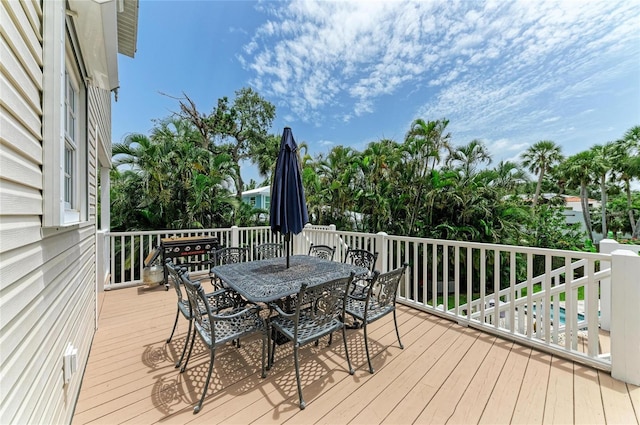 8963 Fishermens Bay Dr, Sarasota, FL 34231 - wooden terrace with outdoor dining space