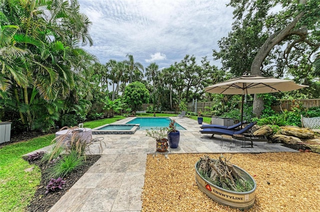8963 Fishermens Bay Dr, Sarasota, FL 34231 - view of pool with a fenced backyard, a patio, and a pool with connected hot tub
