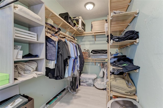 8963 Fishermens Bay Dr, Sarasota, FL 34231 - spacious closet with wood finished floors