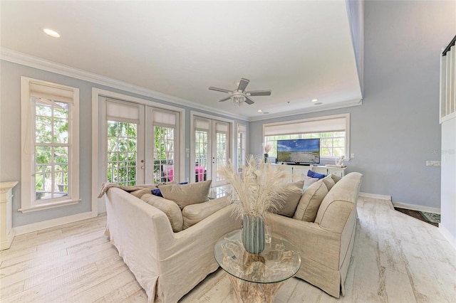 8963 Fishermens Bay Dr, Sarasota, FL 34231 - living room featuring french doors, light wood-style flooring, crown molding, a ceiling fan, and recessed lighting