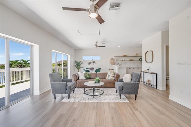 800 NW 36th Ave, Cape Coral, FL 33993 - living area with ceiling fan, light wood-style floors, and baseboards