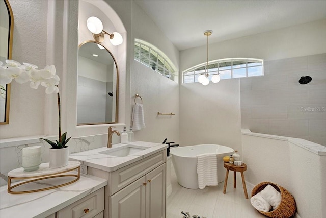 800 NW 36th Ave, Cape Coral, FL 33993 - full bath with a soaking tub, walk in shower, two vanities, and tile patterned floors