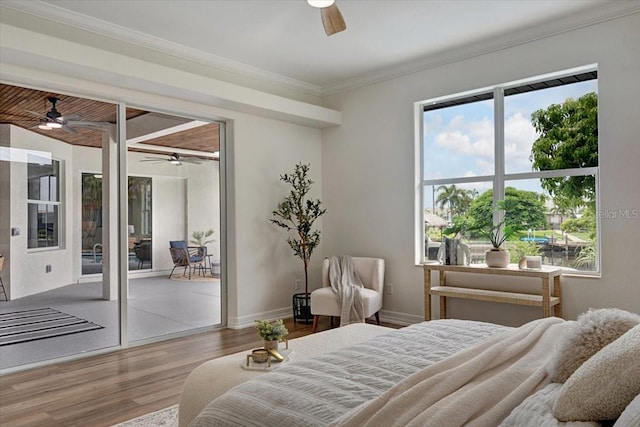 800 NW 36th Ave, Cape Coral, FL 33993 - bedroom featuring wood finished floors, crown molding, baseboards, and a ceiling fan