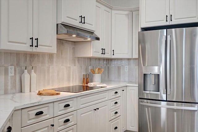 800 NW 36th Ave, Cape Coral, FL 33993 - kitchen featuring stainless steel fridge, under cabinet range hood, black electric cooktop, and white cabinets
