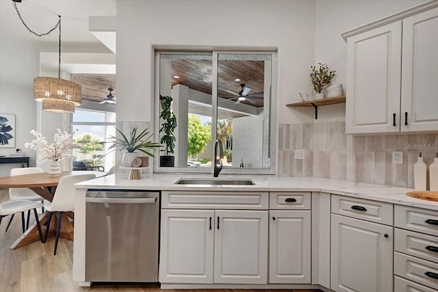 800 NW 36th Ave, Cape Coral, FL 33993 - kitchen with stainless steel dishwasher, a sink, ceiling fan, open shelves, and light wood-style floors