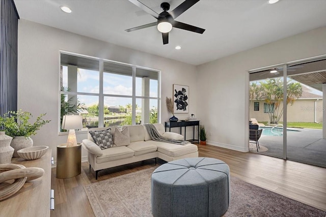 800 NW 36th Ave, Cape Coral, FL 33993 - living room with a ceiling fan, wood finished floors, recessed lighting, and baseboards