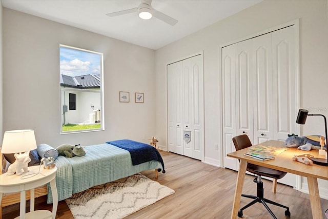 800 NW 36th Ave, Cape Coral, FL 33993 - bedroom with two closets, light wood finished floors, an office area, ceiling fan, and baseboards
