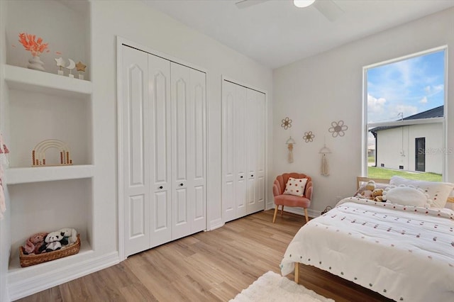 800 NW 36th Ave, Cape Coral, FL 33993 - bedroom with multiple closets, light wood-style floors, and a ceiling fan