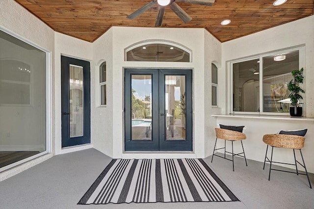 800 NW 36th Ave, Cape Coral, FL 33993 - property entrance with french doors, stucco siding, and a ceiling fan