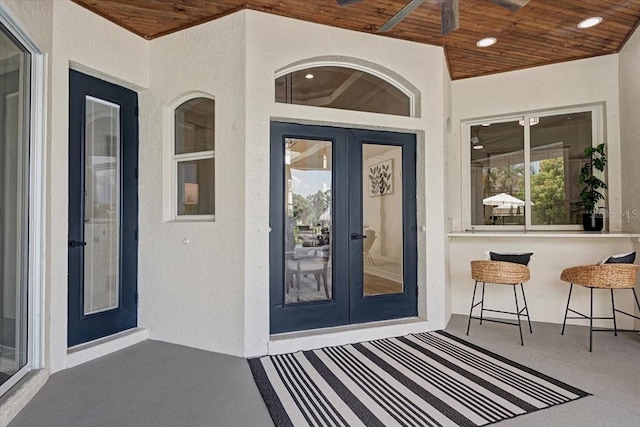 800 NW 36th Ave, Cape Coral, FL 33993 - property entrance featuring stucco siding, french doors, and exterior bar