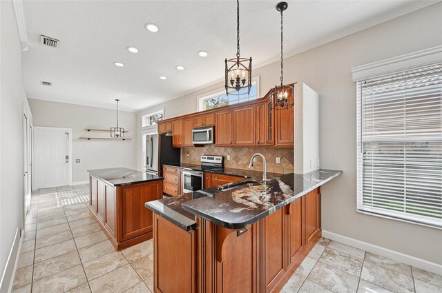 6744 Hickory Hammock Cir, Bradenton, FL 34202 - kitchen with appliances with stainless steel finishes, brown cabinetry, a sink, baseboards, and recessed lighting