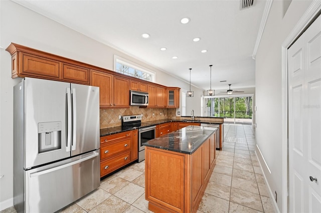 6744 Hickory Hammock Cir, Bradenton, FL 34202 - kitchen featuring stainless steel appliances, a sink, brown cabinets, a peninsula, and recessed lighting