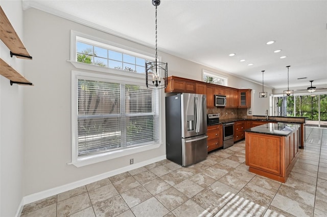 6744 Hickory Hammock Cir, Bradenton, FL 34202 - kitchen with stainless steel appliances, dark countertops, tasteful backsplash, plenty of natural light, and recessed lighting