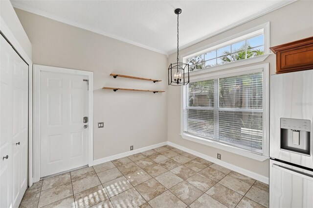 6744 Hickory Hammock Cir, Bradenton, FL 34202 - unfurnished dining area with a chandelier, baseboards, and crown molding