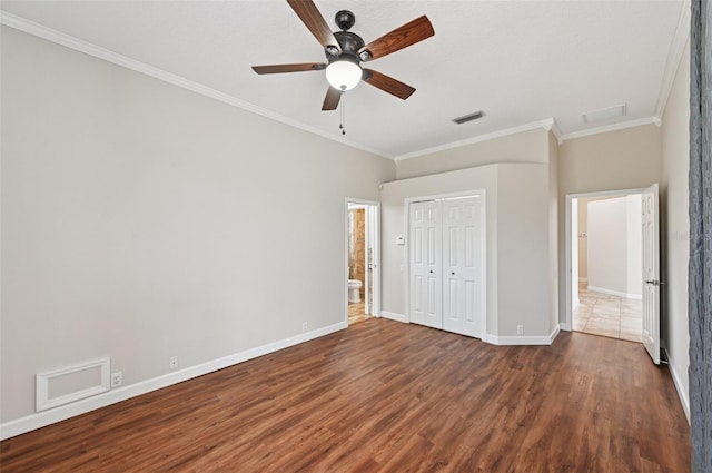 6744 Hickory Hammock Cir, Bradenton, FL 34202 - unfurnished bedroom with ornamental molding, wood finished floors, baseboards, a closet, and ceiling fan