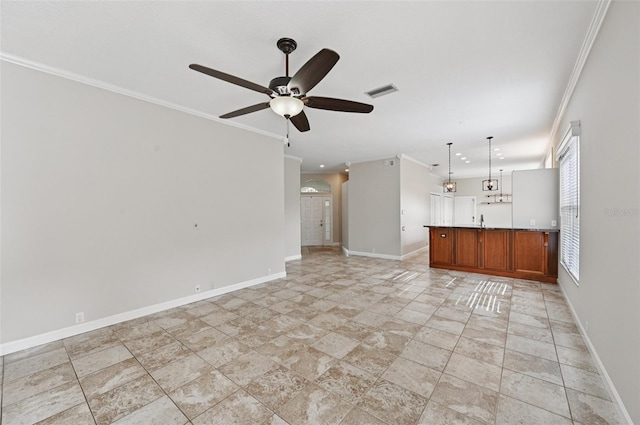 6744 Hickory Hammock Cir, Bradenton, FL 34202 - unfurnished living room with ceiling fan, ornamental molding, baseboards, light stone finish flooring, and arched walkways