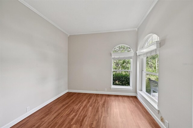 6744 Hickory Hammock Cir, Bradenton, FL 34202 - unfurnished room with ornamental molding, wood finished floors, and baseboards