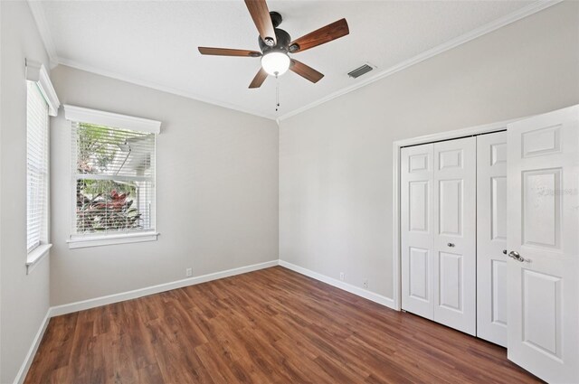 6744 Hickory Hammock Cir, Bradenton, FL 34202 - unfurnished bedroom with wood finished floors, baseboards, ornamental molding, a closet, and ceiling fan