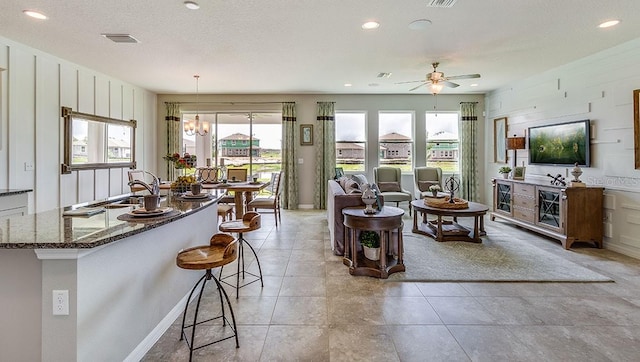 12051 Kingsley Trl, Parrish, FL 34219 - living room featuring plenty of natural light, ceiling fan, recessed lighting, and light tile patterned floors