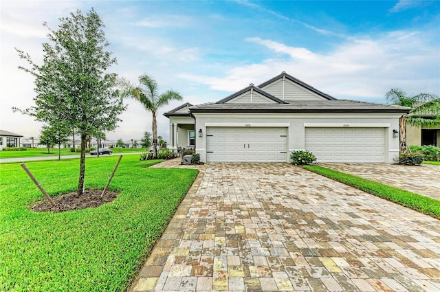 17898 Cherished Loop, Bradenton, FL 34211 - ranch-style house featuring decorative driveway, a front yard, a garage, and stucco siding